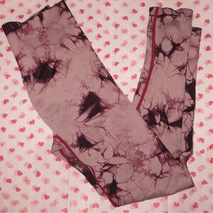 Red & black tie-dye leggings with red trim.